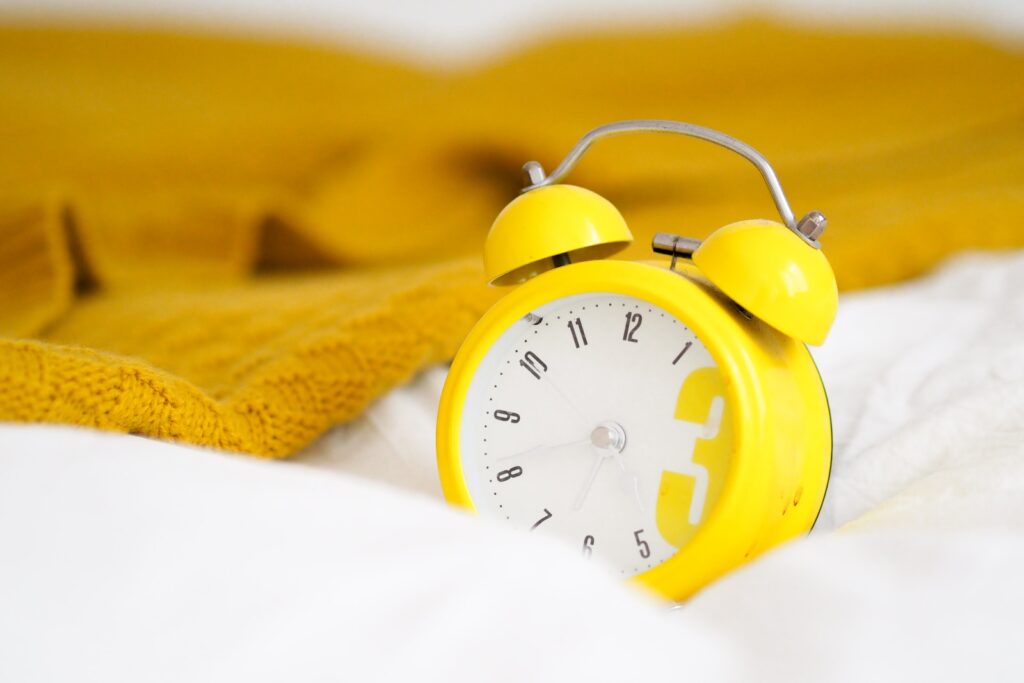 yellow alarm clock at 10 10