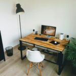 black flat screen computer monitor on brown wooden table
