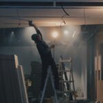 man on white ladder